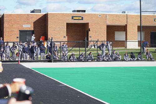 field hockey and lacrosse complex people behind of gray fence college park